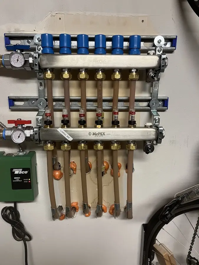 Plumber performing Water Heater Repair at a residential property in Helena-West Helena